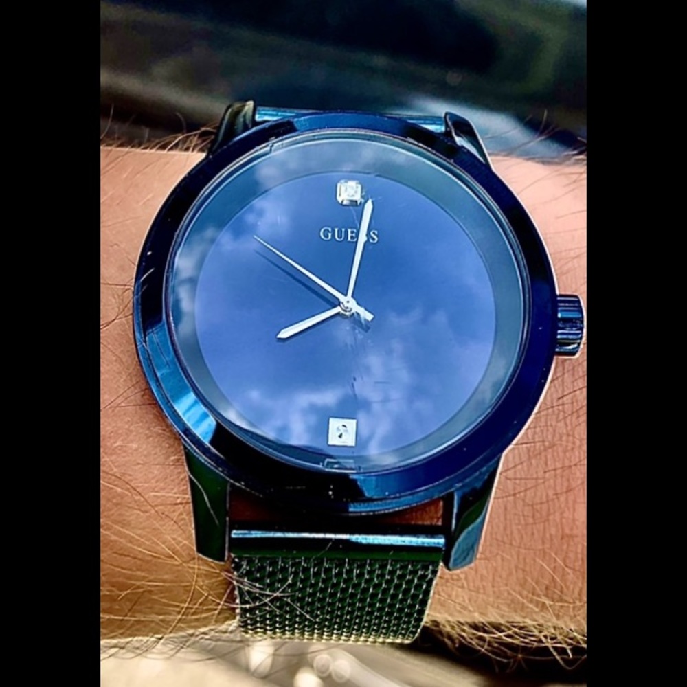 Diamond embedded, Sterling Silver GUESS watch.